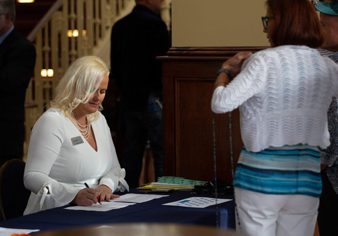 volunteers signing in an getting name tags